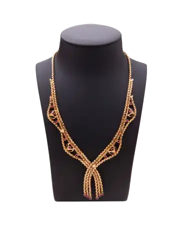 Art Deco Ruby Necklace in 18 karat yellow gold with fancy motif. Available at VIRTU LUXURY.