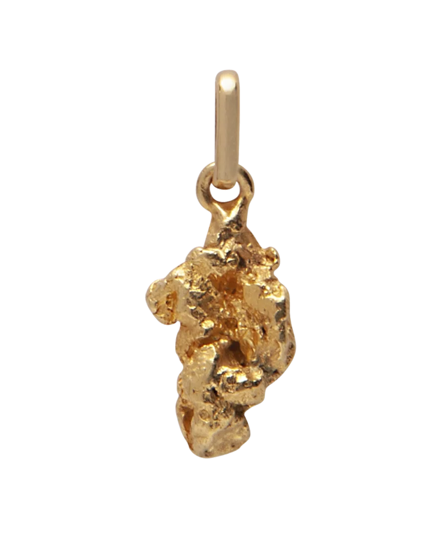 A pendant with a 22 Karat Yellow Gold Nugget. Available at VIRTU LUXURY. A pendant with a 22 Karat Yellow Gold Nugget. Available at VIRTU LUXURY.