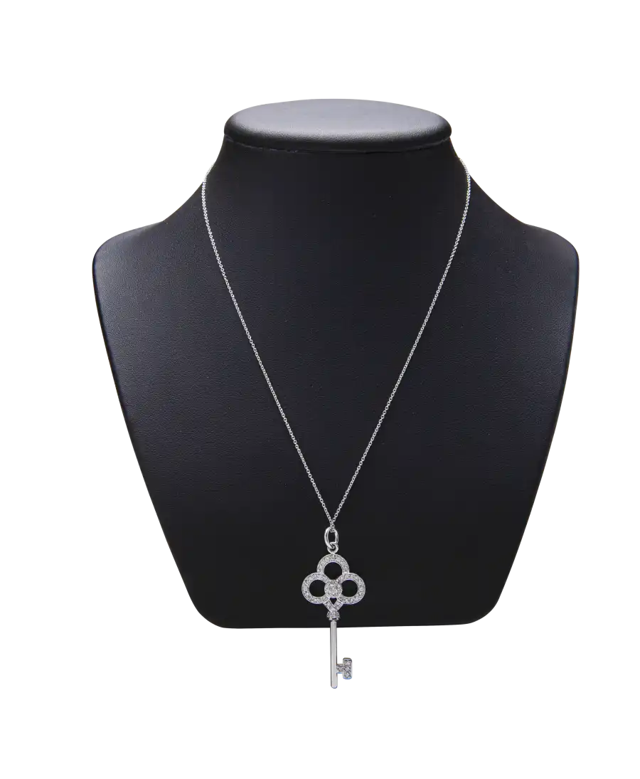 TIFFANY KEYS Crown Key in 18-Karat White Gold with Diamonds. Available at VIRTU LUXURY. TIFFANY KEYS Crown Key in 18-Karat White Gold with Diamonds. Available at VIRTU LUXURY.