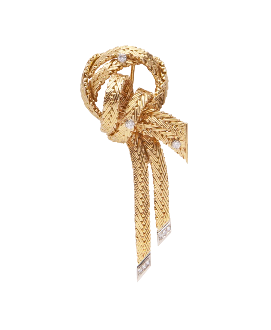 Bow brooch in 2-tone yellow and white gold. Available at VIRTU LUXURY.