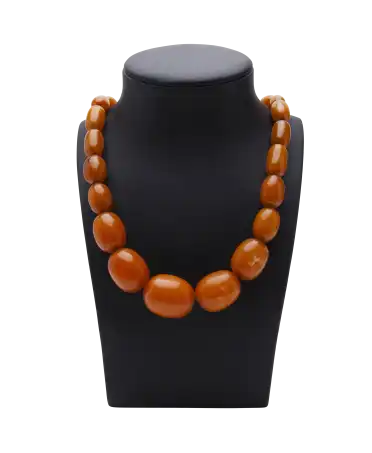 Opaque orange Amber necklace. Available at VIRTU LUXURY.